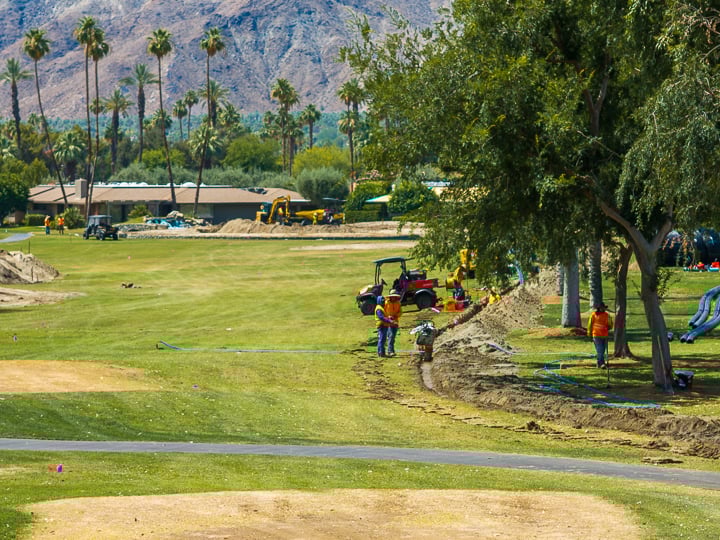 Telephoto shot of Hole 16 capturing the approach into the green, with layered visual depth and course details in focus.