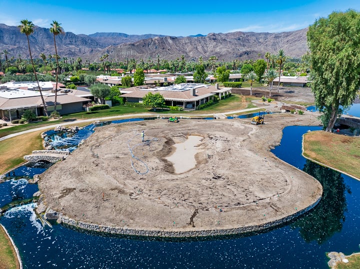 Demolition in progress on Hole 16, with the green and surrounding area undergoing removal and preparation for reshaping.