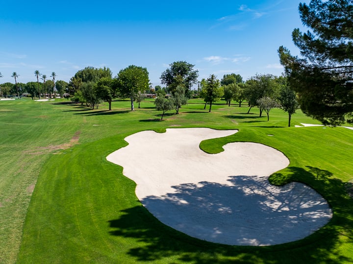 Bunker on Hole 2 with a view toward the renovated green, showcasing refined shaping and layout.