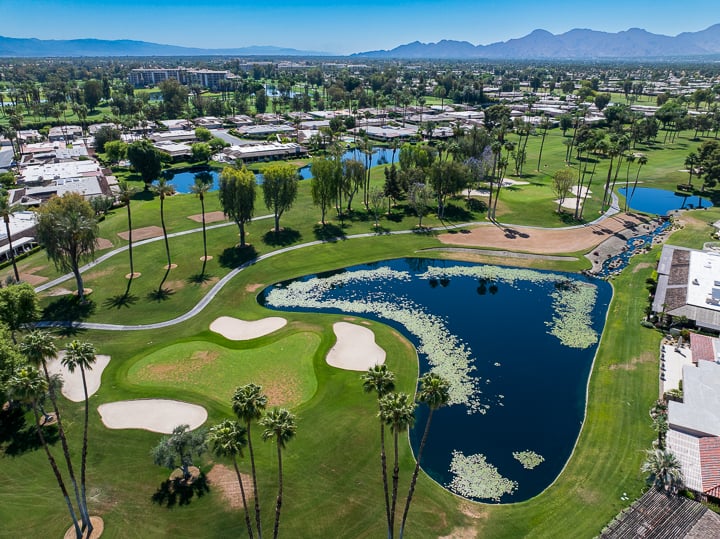 Hole 8 at The Springs Country Club prior to renovation, displaying the original fairway, green, and bunkers in their pre-renovation condition.