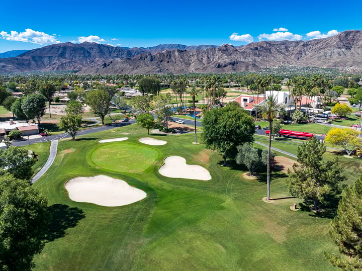 View of Hole 9 at The Springs Country Club prior to renovation, showing original green, fairway, and bunker layout in its pre-renovation state.