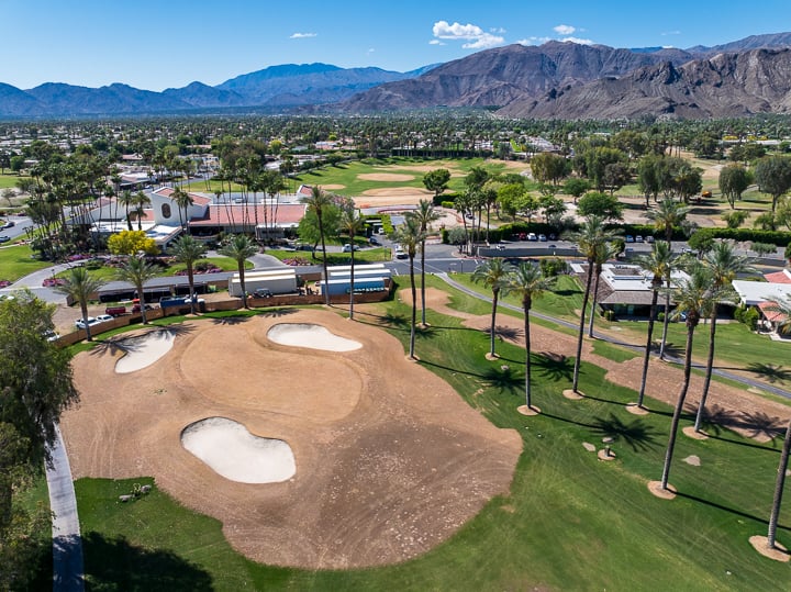 Hole 6 at The Springs Country Club prior to renovation, featuring the original green, fairway layout, and mature landscape in its untouched condition.