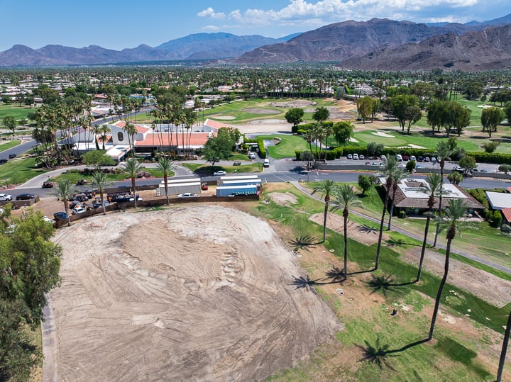 Hole 6 post-demolition and prepped for shaping at The Springs Country Club, with cleared ground and early contours visible.