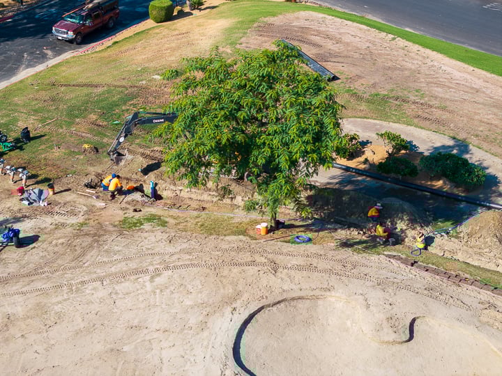 Main line trenching between Holes 7 and 9, part of ongoing irrigation infrastructure improvements.
