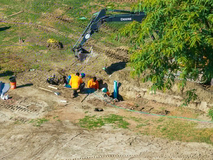 Main line trenching between Holes 7 and 9, part of ongoing irrigation infrastructure improvements.
